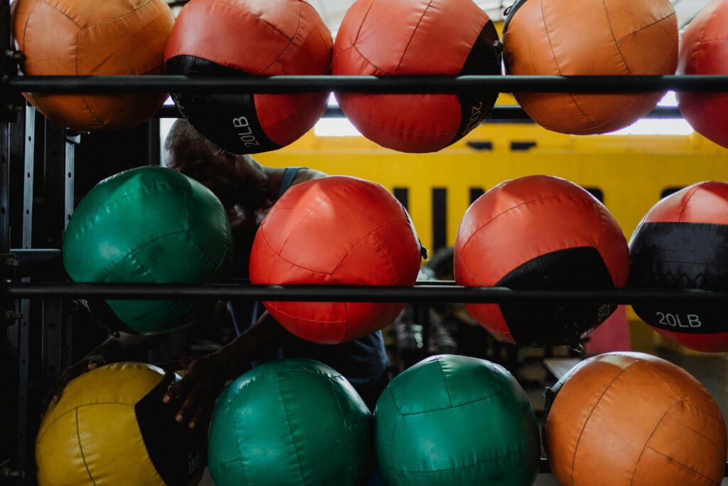 Colorful medicine balls displayed in a gym, ideal fitness and training visuals.