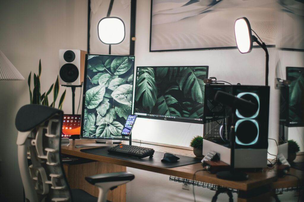 Stylish gaming and streaming setup with dual monitors, PC, and accessories.