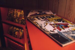 Close-up of a vintage Thor comic book displayed in an art gallery or store.