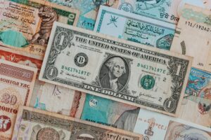 Close-up of various international banknotes creating a diverse currency background.