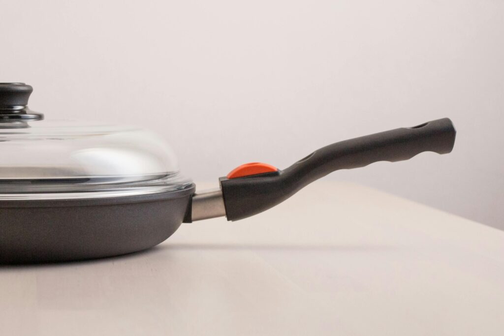 A high-quality nonstick frying pan with a glass lid perfect for modern kitchens.