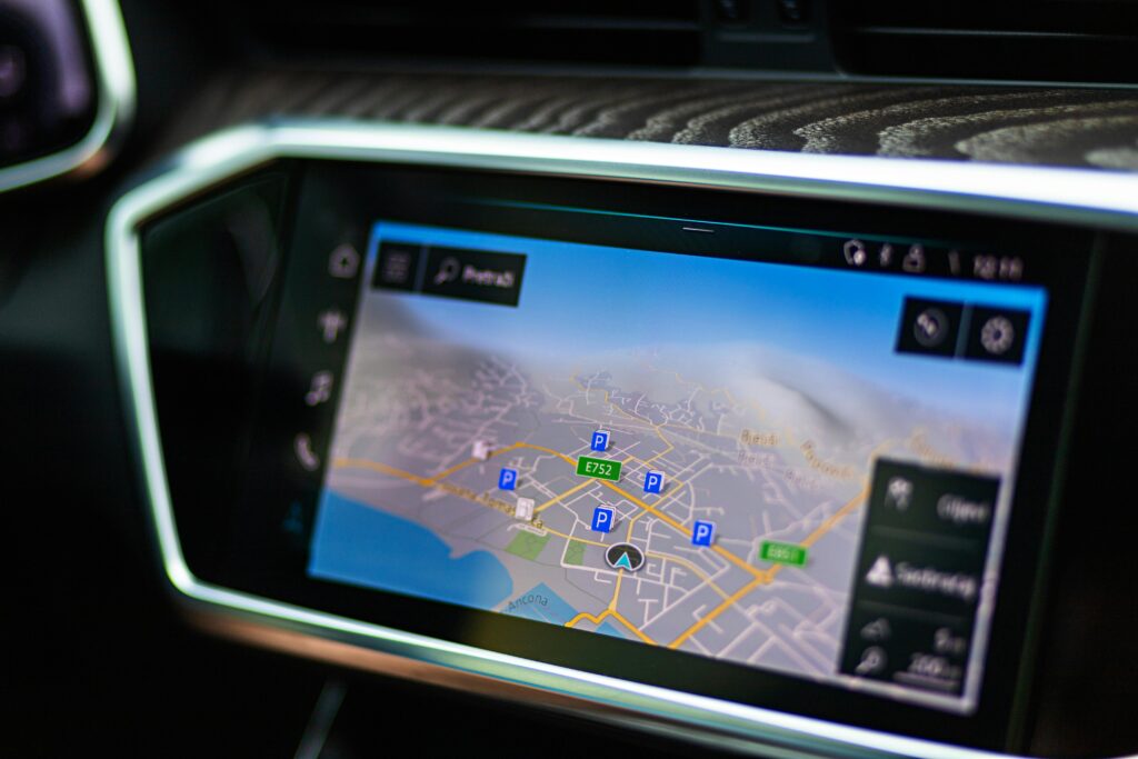 Close-up of a car's touchscreen displaying GPS navigation in a modern vehicle interior.