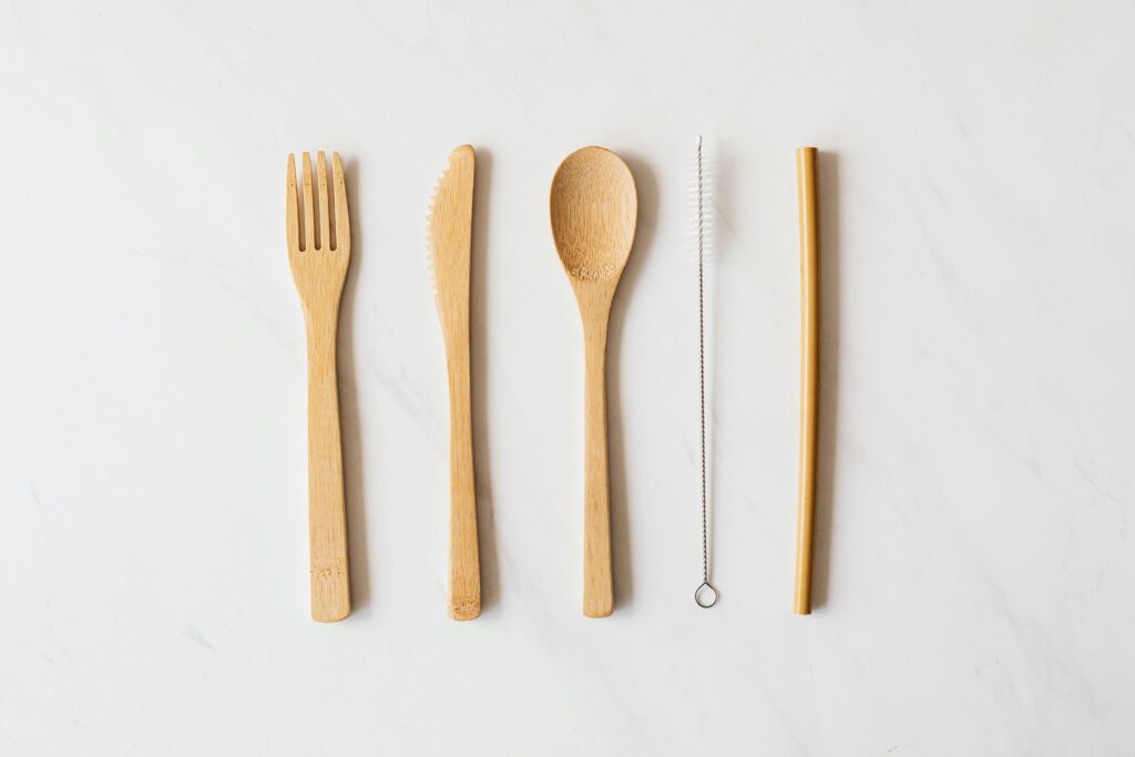 Minimalist wooden cutlery set on marble for eco-friendly dining