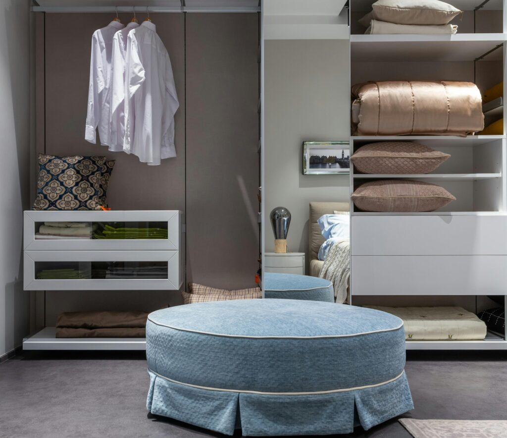 Contemporary bedroom closet featuring neat apparel and soft textiles, perfect for stylish interiors.