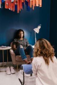 A woman enjoys a calming pedicure in a stylish hair and nail salon.