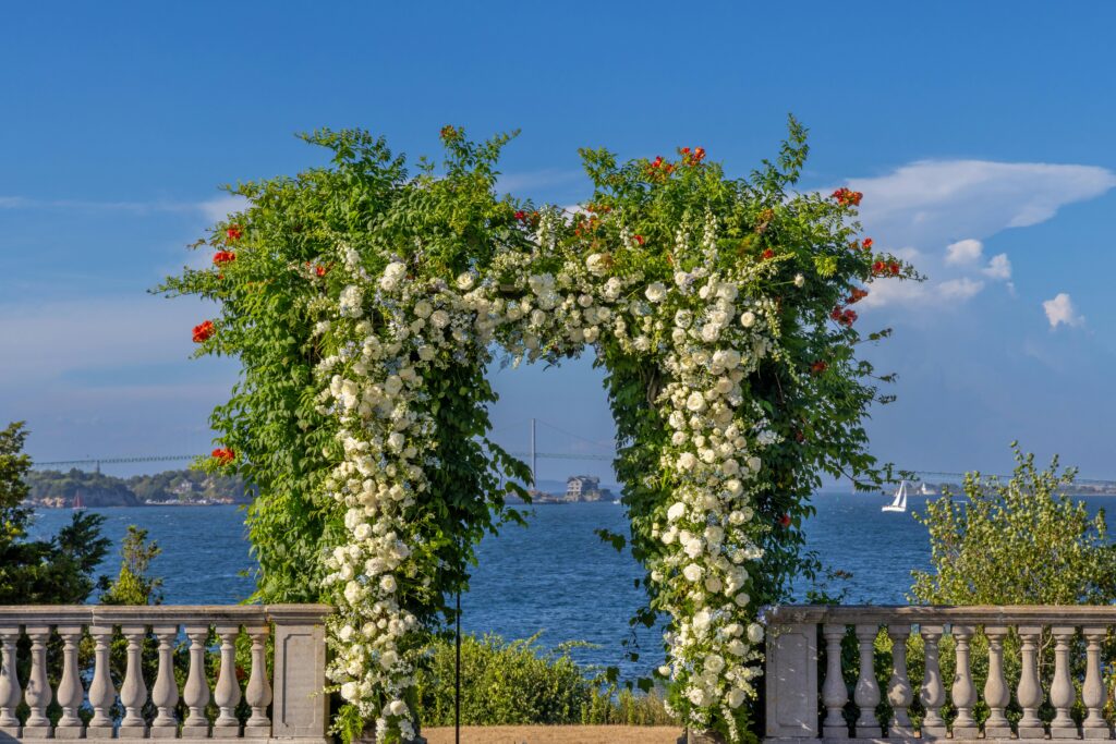 Elegant floral arch with ocean view in Newport, RI. Perfect for weddings and ceremonies.